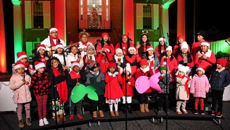 The Children’s Choir of St. Michael’s Catholic Church sings “Mi Burrito Sabanero” at the 2023 Caroling on the Circle event. DAN COOK PHOTO