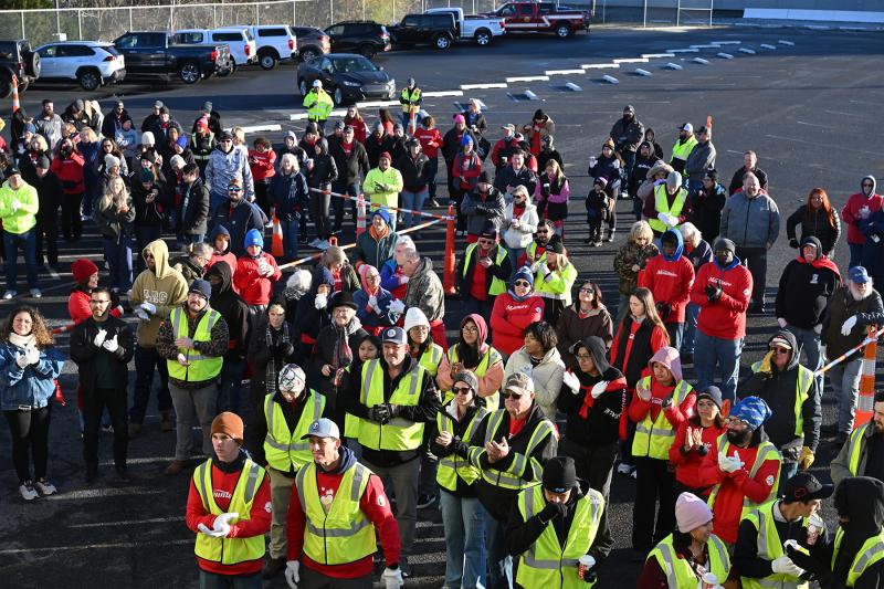 The crowd of volunteers begins to gather, and the safety conversation begins.