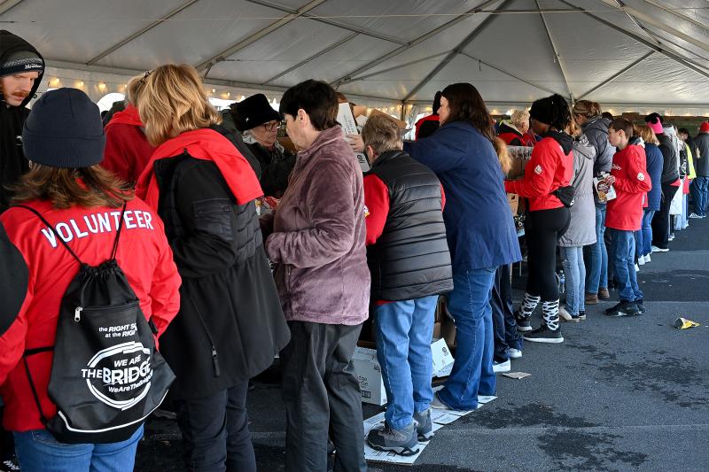 A line full of diligent volunteers works through a busy – but not hectic – morning.