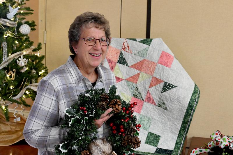 Michelle Lapkin bought the last homemade quilt, among other items.