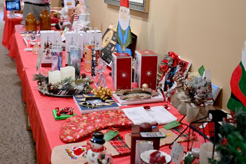 Several tables are set up with items for sale, and 100 percent of the proceeds helps support Delaware Hospice Center residents.
