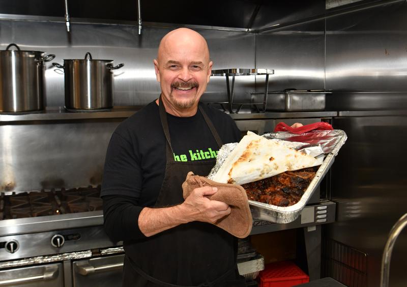 Mike Tyler, coordinator of the Epworth Food Program, prepares meatloaf for the Sunday meal.