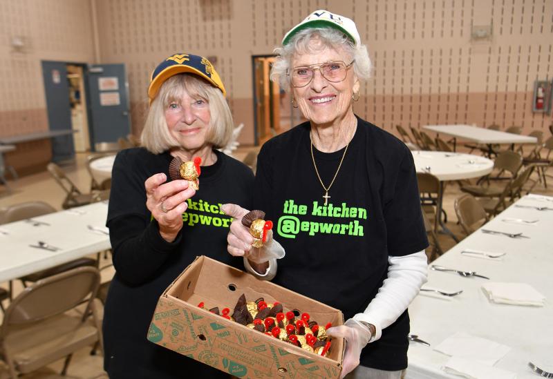 Carolee Botts, left, and Barbara Henriksen display the edible turkey treat for the centerpieces.