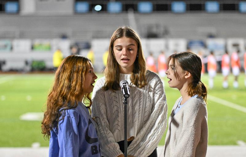 Cape Chorale students singing the national anthem are (l-r) Dylenn Enright, Marley Fyock and Willow DiMichele.