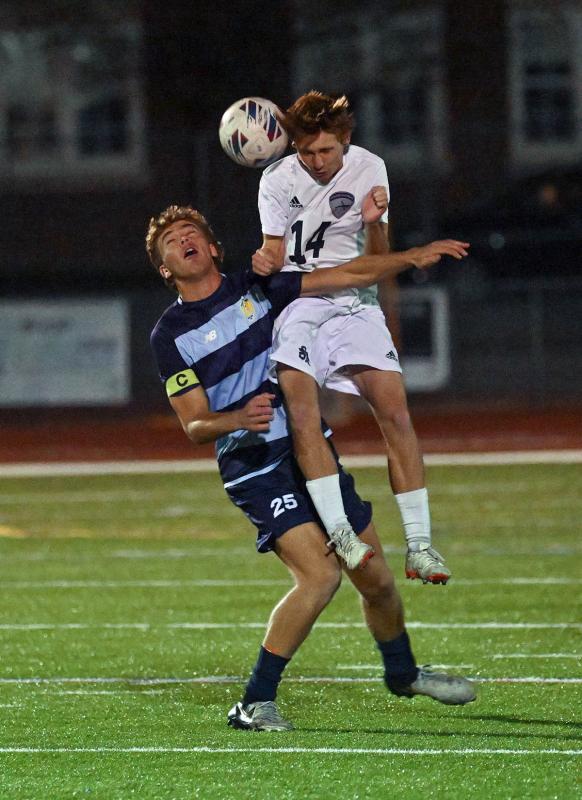 Sussex Academy senior Aleksander Danilenko heads the ball away from Cape’s Evan Burris.