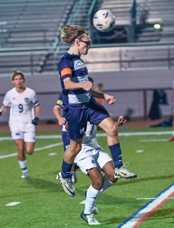 Cape senior captain Cardin Benjamin heads the ball downfield for the Vikings.