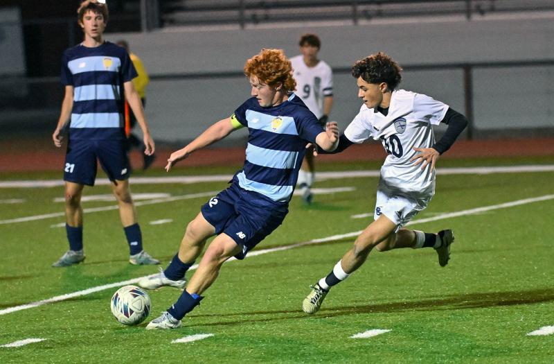 Cape senior Brandon Loucks moves the ball with Seahawks player Liam Stegall in pursuit.