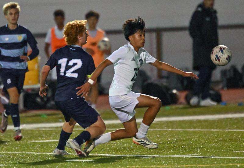 Sussex Academy junior Ruendi Ortiz-Santos moves the ball away from Cape’s Brandon Loucks.