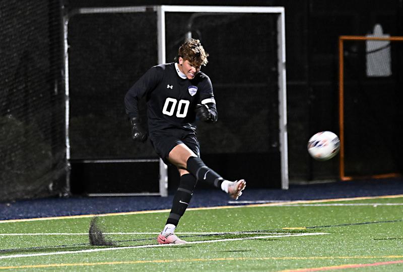 Sussex Academy keeper CJ Norton clears the ball after a save.