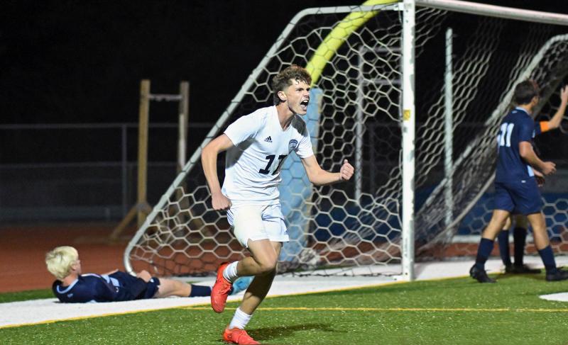 Sussex Academy junior Chase Ballinger celebrates the game-winner.