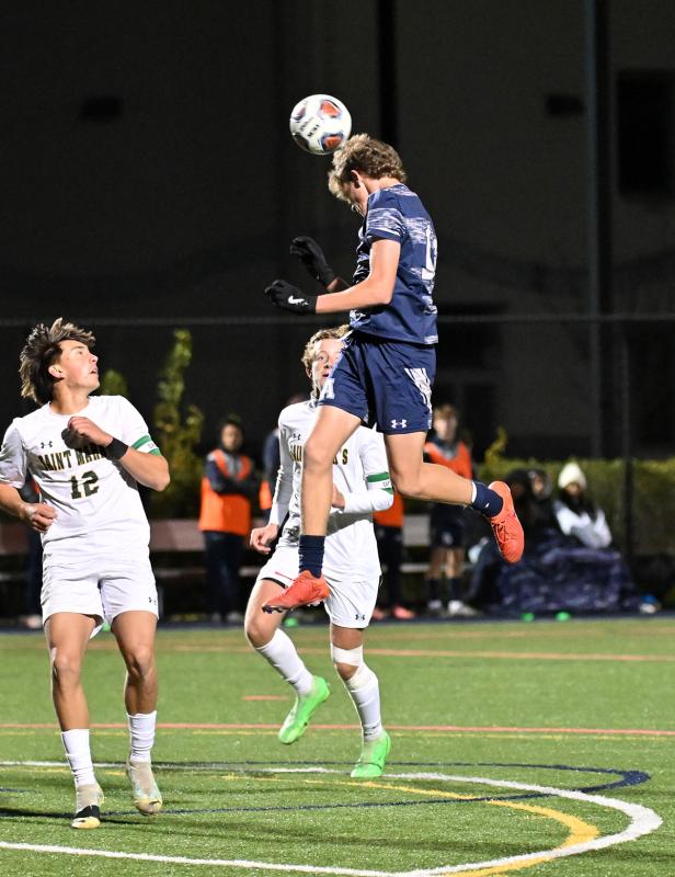 Seahawks forward Chase Ballinger gets major air to head the ball at the Spartan goal.
