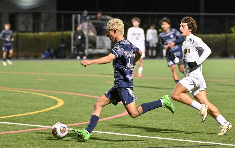 Senior defender McKenna Danahy speeds the ball away from Saint Mark’s player Trey Spohn.