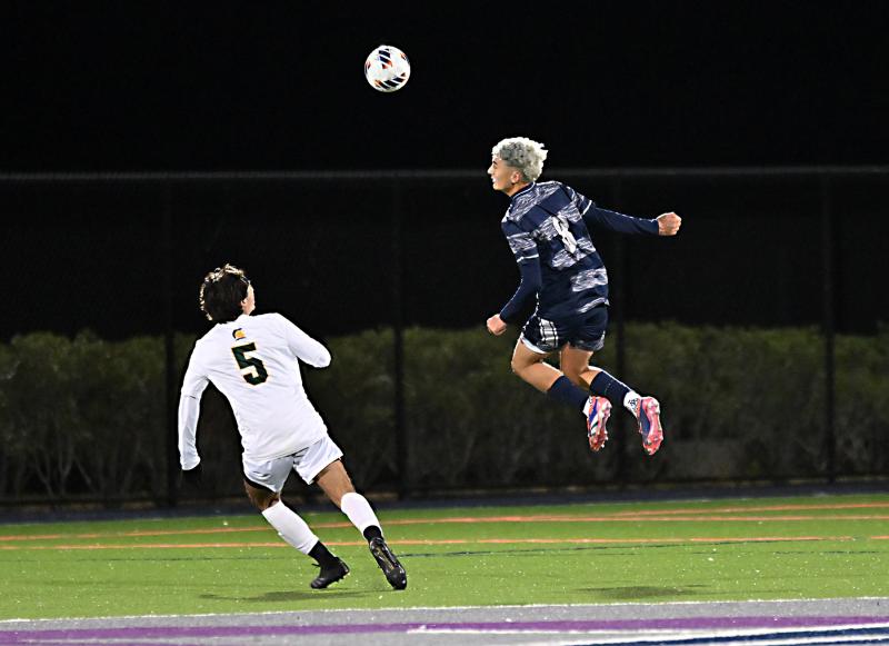 Sussex Academy senior defender Aiden Villar flies to the ball for a header.