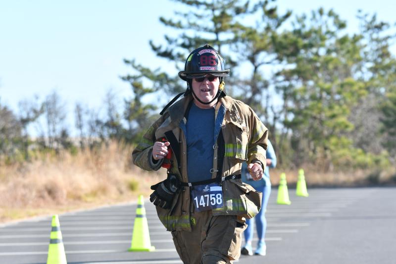 David Hantman, 67, of Station 86 in Rehoboth runs in full gear, clocking a time of 46:02.