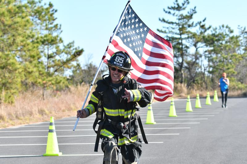 Allen Jackson of Station 85 in Milton completes the Tunnel to Towers in full gear. DAVE FREDERICK PHOTOS