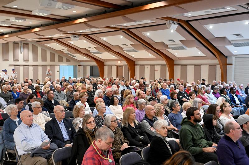 The hall was packed with people enjoying the show.