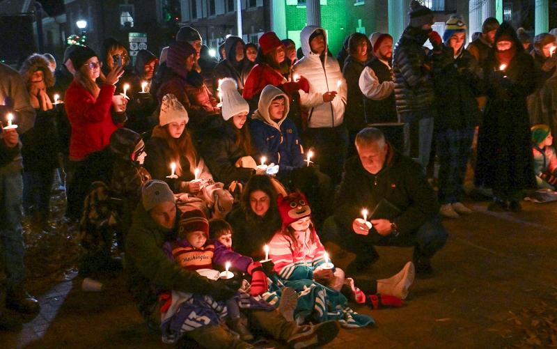 A large crowd braved the cold temperatures to see the living nativity and participate in the candlelight service on The Circle in Georgetown. DAN COOK PHOTOS