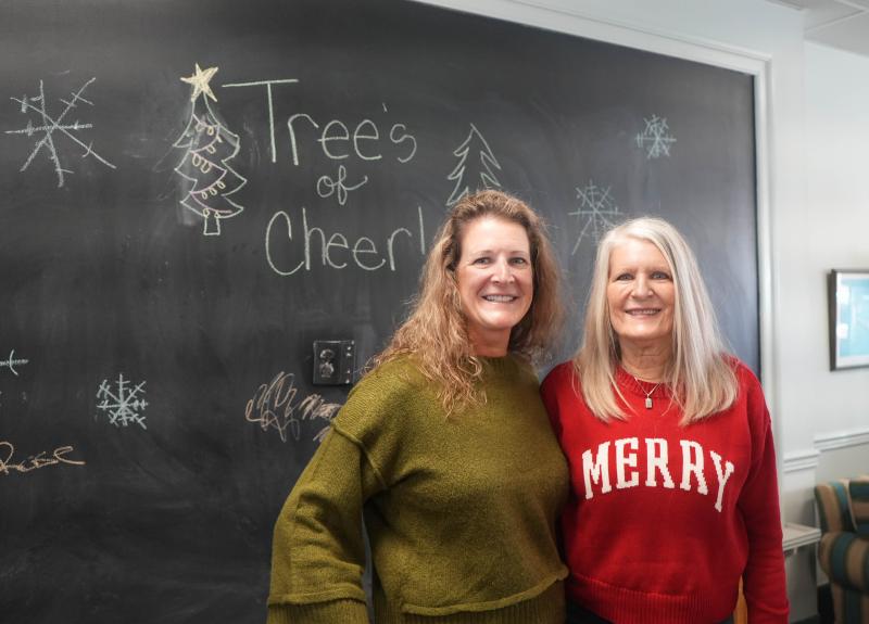 Nicole Pierce, left, and Kathy Weiss volunteer at the Trees of Cheer event in Lewes.