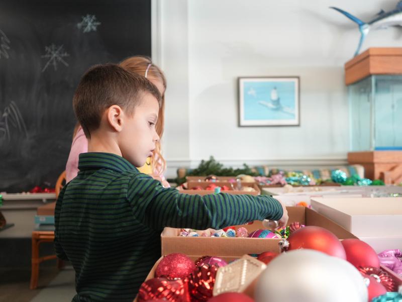 Charlie Richards picks out an ornament for his family’s tree.