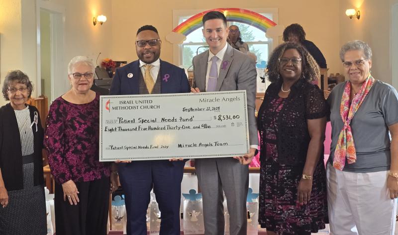 Check presentation attendees shown are (l-r) Carolyn A. Morris, Sandra Neal, Maurice Winkfield, Sean Flanigan, the Rev. Marjorie Belmont and Betty J. Streett. SUBMITTED PHOTO