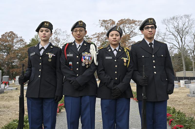 Cadet Cpl. Abagail Angel, Cadet Sgt. Major Jasmine Ramos-Trejo, Cadet Capt. Addie Rameriz, and Cadet Bijan Schoret of the Cape Henlopen High School JROTC stand at attention prior to the start of the ceremony.