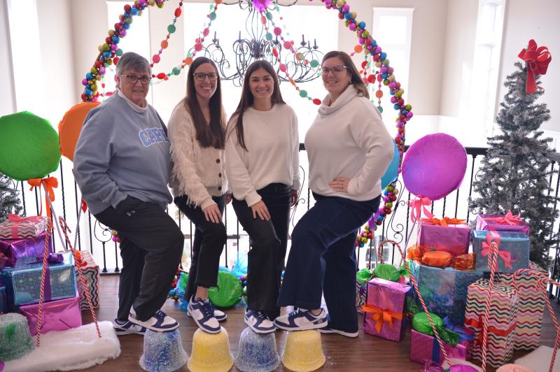 Showing off their new shoes are coaches (l-r) Deb Windett, Kate Austin, Cassidy Best and Katie Collick.
