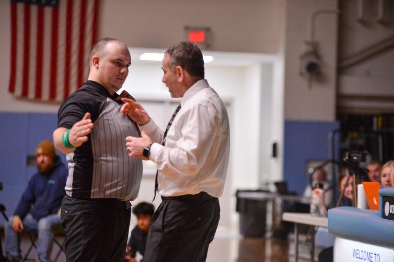 Cape coach Chris Mattioni goes to bat for his wrestler Cale Baker. DAVE FREDERICK PHOTOS