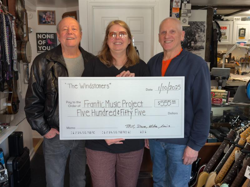 Check presentation attendees shown are Bill Breitmayer, left, and David LaVallee, Windstoners, with Mary Knight, Frantic Music Project co-founder. SUBMITTED PHOTO