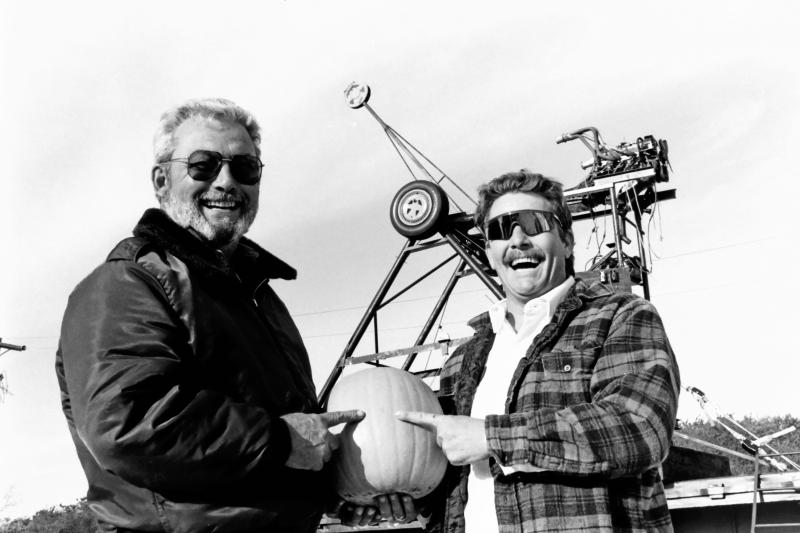 Jay B. Walsh and Larry McLaughlin stand in front of their Punkin’ Chunkin launcher, De-Terminator, in 1993, and hold the pumpkin that they say will shatter the world record pumpkin toss of 852 feet they set last year.