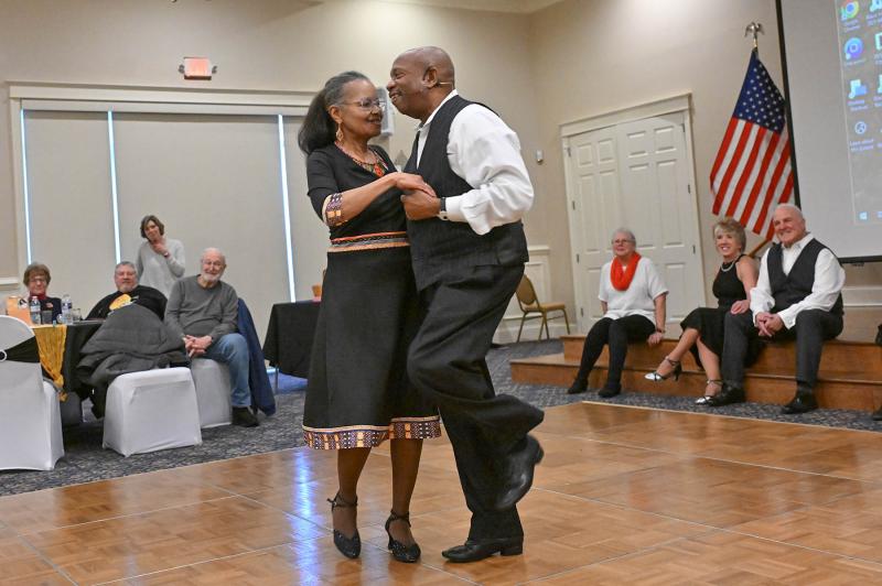 Pat and Dennis Higginbotham of the Indy Swing Dancers demonstrate a pairs dance for the group.