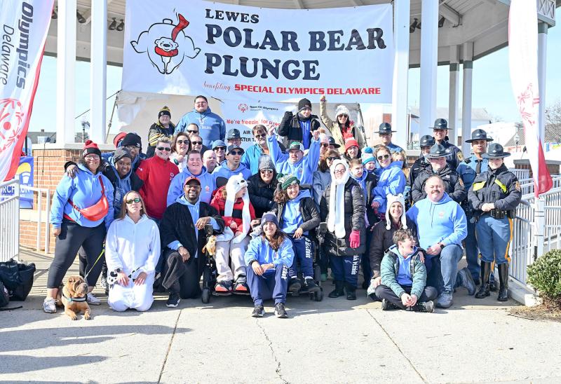 The Special Olympics Sussex Riptide team poses with friends and family.