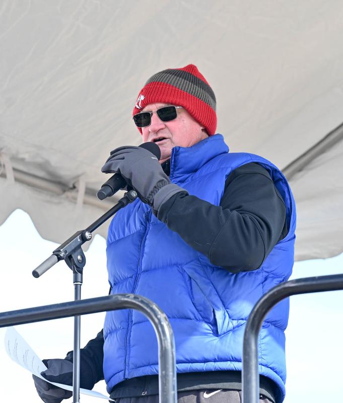 Longtime emcee of the plunge Jon Buzby welcomes attendees to the event.