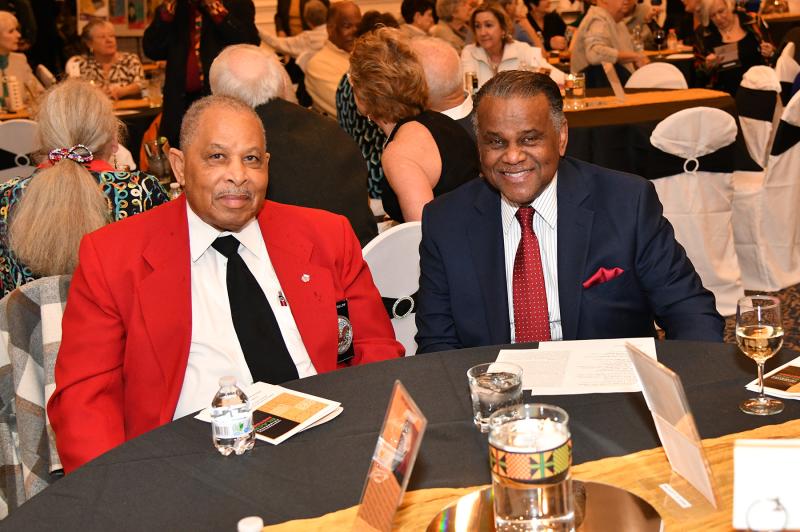 Larry Freelow of the East Coast Chapter of the Tuskegee Airmen, left, sits with his good friend Alvin Smith.