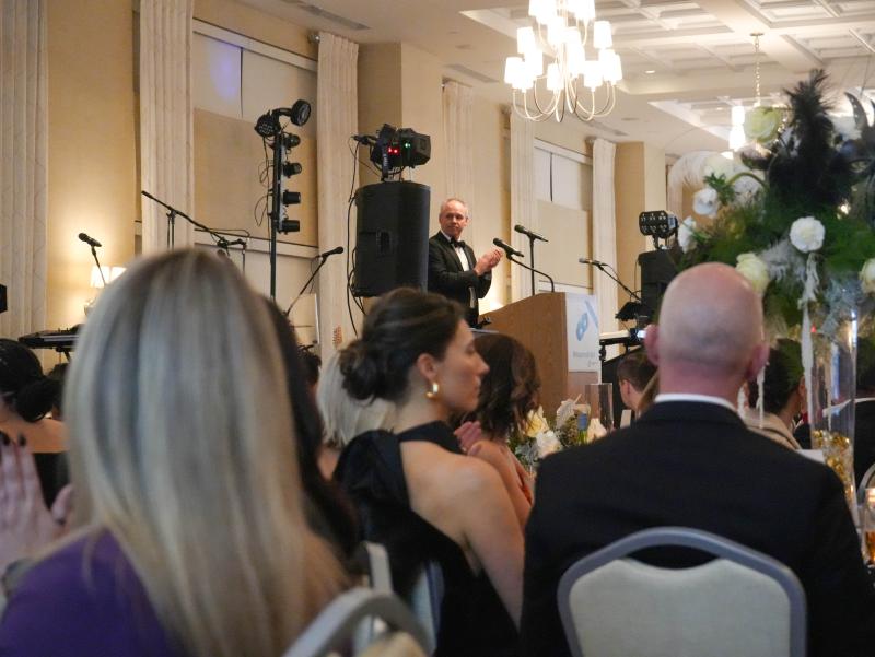 John Wellons speaks on stage at the Boys & Girls Clubs of Delaware’s 11th annual Masquerade Ball.