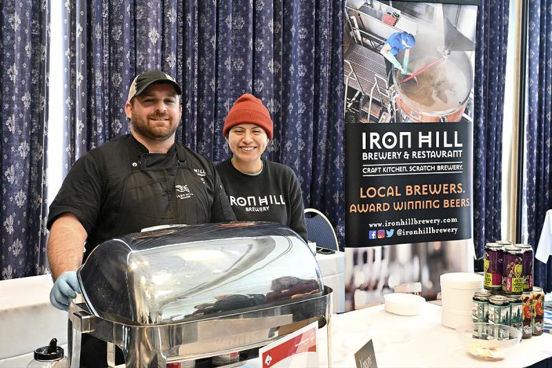 Nathan Maggioli and Nora Perez represent Iron Hill Brewery.