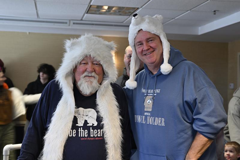 Wearing polar bear-themed headgear, Norm Dagg and Dean Snyder pose for a photo. TED PFIRRMANN PHOTOS