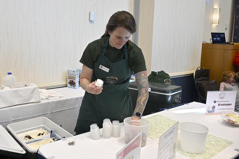 Gretchen Lauer of Woodside Farm Creamery works her stand.