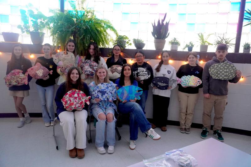 Sussex Academy students displaying their paper-mache fish are in back (l-r) Caroline Olewiler, Kadence King, Capucine Duvert, Eva Boos, Mary Lu Sanchez, Briseyda Ortiz Miguel, Gigi Miranda, Skyla Edmondson and Evan Spanos. In front are Bella Crisci, Hannah Purse and Francesca Fratini. SUBMITTED PHOTO