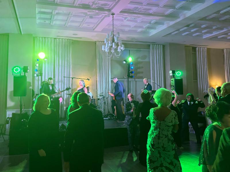 Masquerade Ball attendees hit the dance floor for an energetic performance by Blue Label Band.