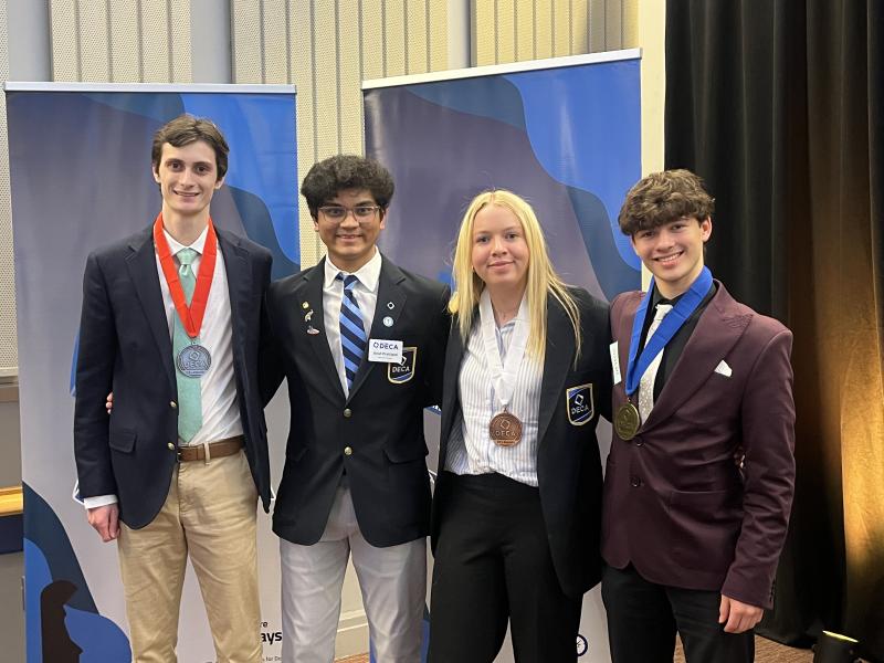 Cape student and 2024-25 Delaware DECA President Krish Prattipati, second from left, stands with the three Personal Financial Literacy event competitors, who swept the event. Shown are (l-r) are Stephen Hart, Prattipati, Ellie Sprague and Sullivan Naden.