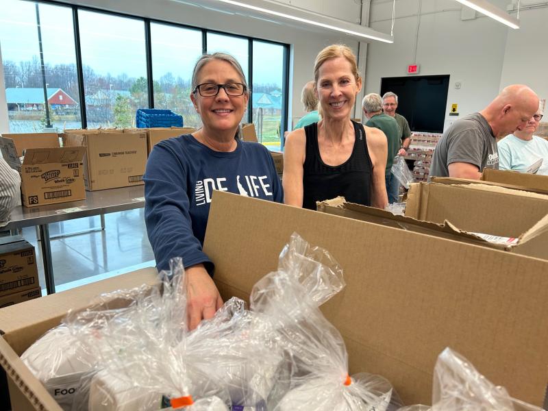 During last year’s Do More 24 statewide fundraising day for nonprofit organizations, Food Bank of Delaware volunteers Dedee Gengler, left, and Laura Fiewegerack pack weekend meal kits for schoolchildren and their families in Sussex and Kent counties. RYAN MAVITY PHOTO