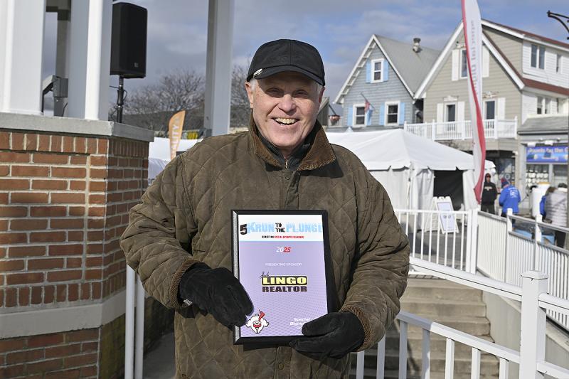 Jack Lingo proudly displays his sponsor plaque.