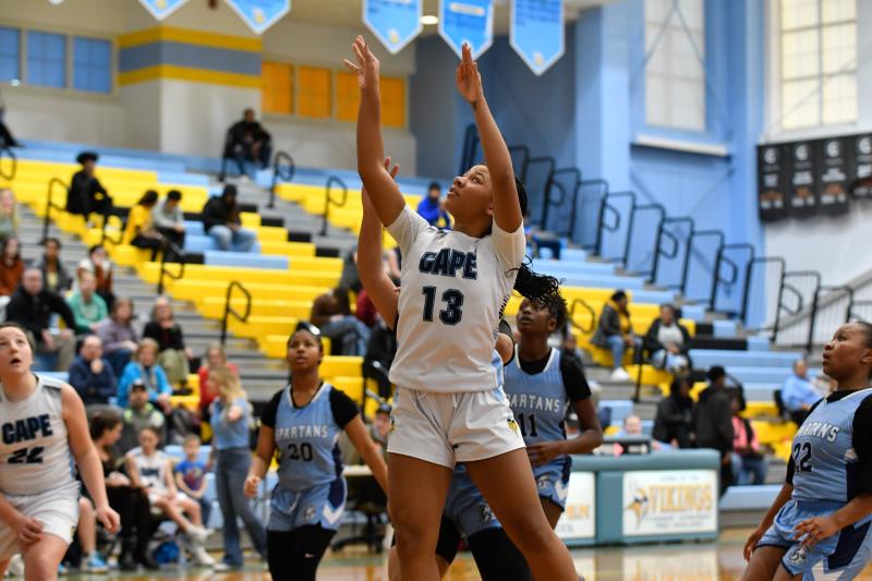 Malia Jackson scores a basket on the offensive boards.