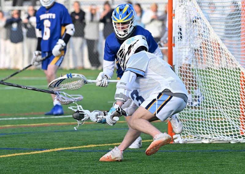 Cape senior attack Burke Healy goes for a wrap-around goal.