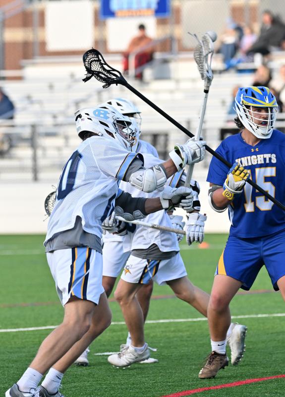 Cape senior middie Evan Burris shoots and scores.