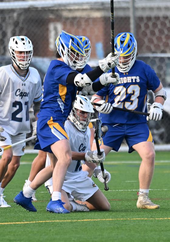 Sophomore Tate Mauro maintains possession after getting knocked down in a crowd of Knights.