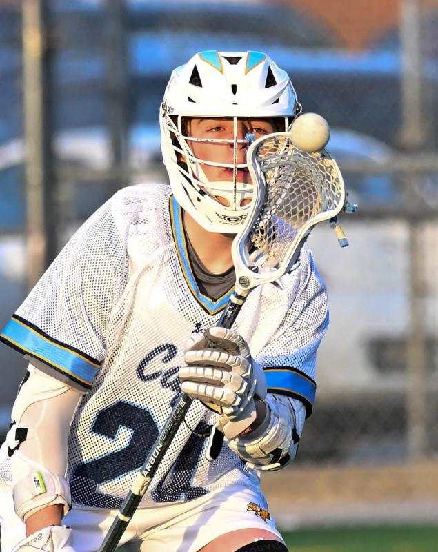 Cape sophomore Liam Crotty watches the ball into his crosse as he snags a pass in the win over the Golden Knights.