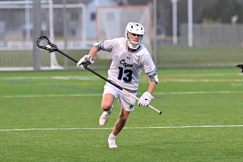 Cape sophomore long pole Tate Mauro clears the ball from the Central offensive zone.
