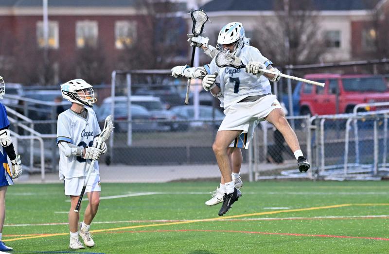 Cape junior David Adili-Khams, right, celebrates his first varsity goal with teammates. DAN COOK PHOTOS