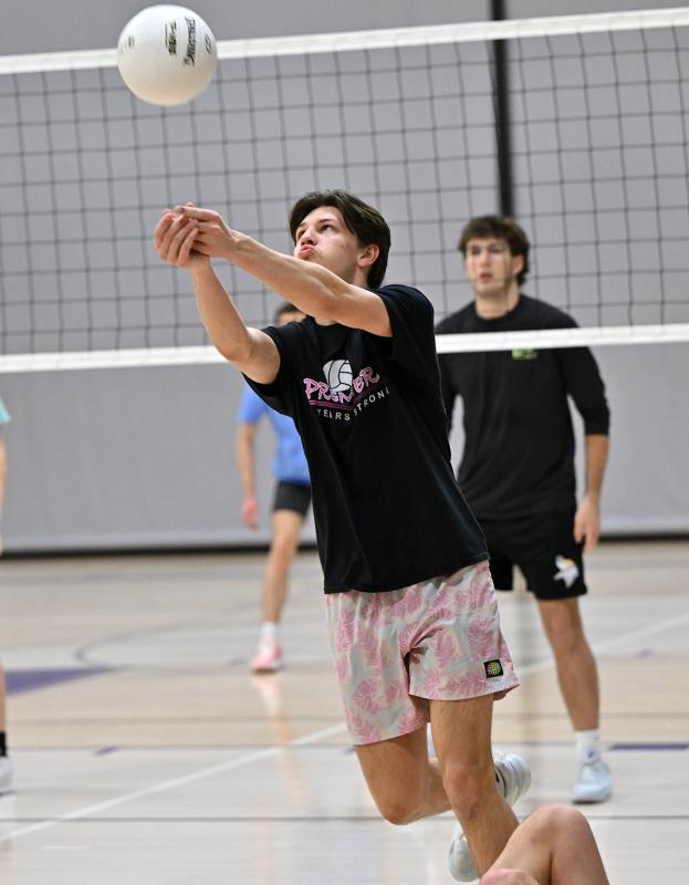 Royals senior Ethan Fels bumps a dig in the scrimmage with the Vikings.